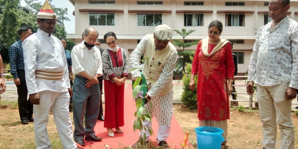 Justice Sommader planting a tree in front of the court of District and Sessions Judge