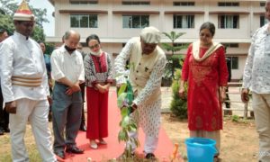 Justice Sommader planting a tree in front of the court of District and Sessions Judge